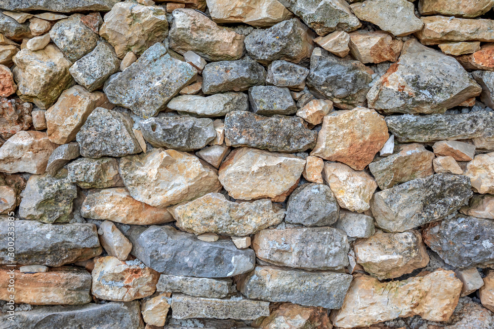 Fototapeta premium Detail of an old wall made of natural stone blocks