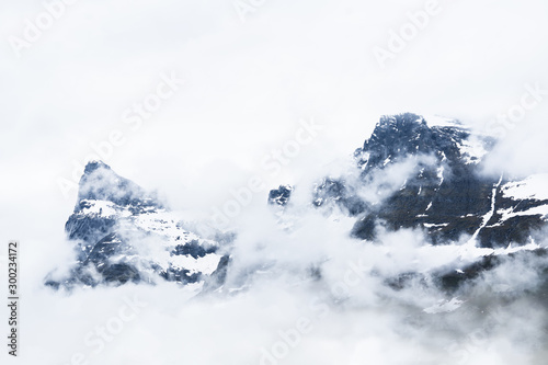 Mountains covered in snow. Foggy winter landscape