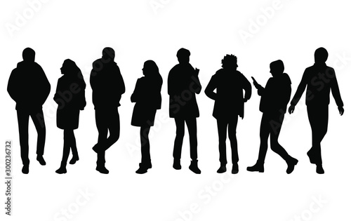 Vector silhouettes of men and a women, a group of standing business people, black color isolated on white background