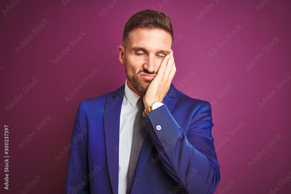Young handsome business man over purple isolated background thinking looking tired and bored with depression problems with crossed arms. Young handsome business man over purple isolated background thinking looking tired and bored with depression problems with crossed arms.
