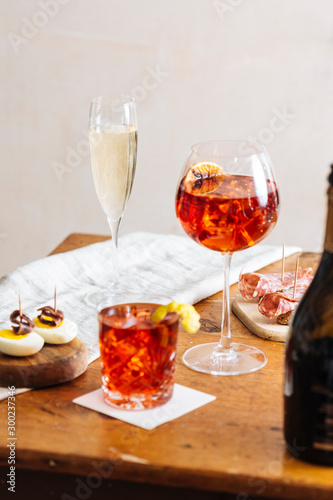 Prosecco cocktail aperitif. Prosecco is a white sparkling italian wine; with bitter and an orange slice become Spritz Veneziano. With cicchetti, boiled egg, meat ball Polpetta and Soppressa