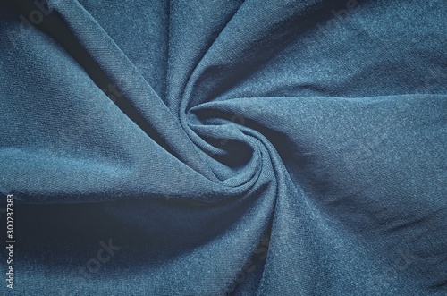 Interesting conceptual background with clothes. Texture from navy blue wrinkled material.