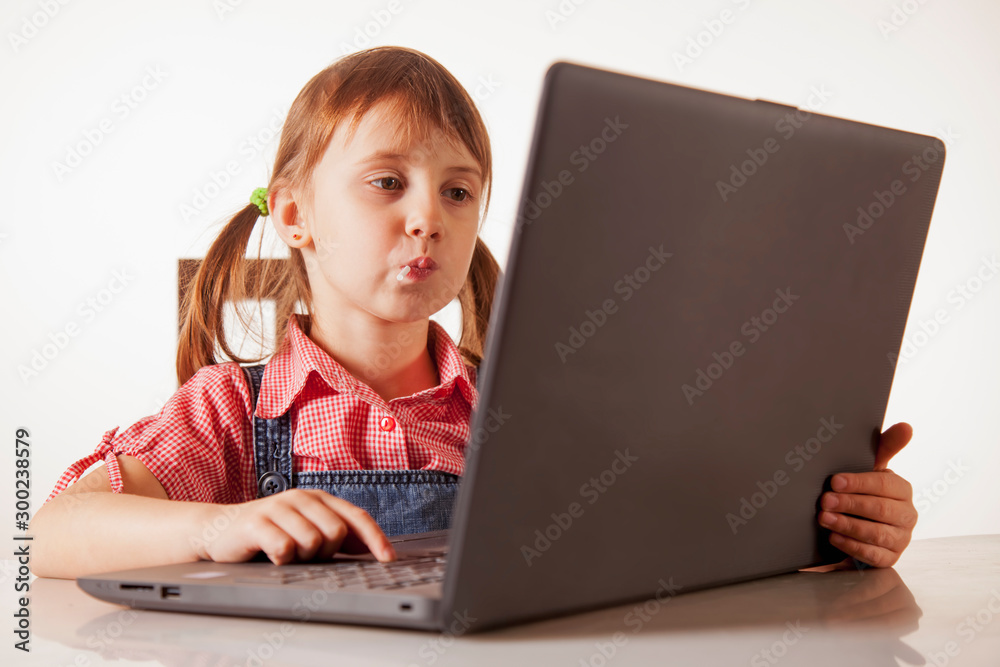 Humorous photography of beautiful young girl programmer working with laptop Humorous photography of beautiful young girl programmer working with laptop
