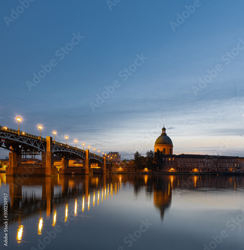 View of Chapelle Saint-Joseph and bridge Pont Saint-Pierre from the square Place Saint-Pierre at Sunset in Toulouse France