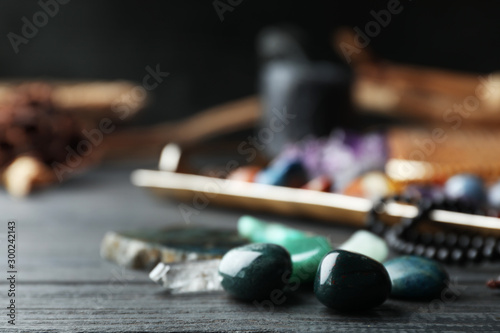 Φωτογραφία Many different gemstones on black wooden table