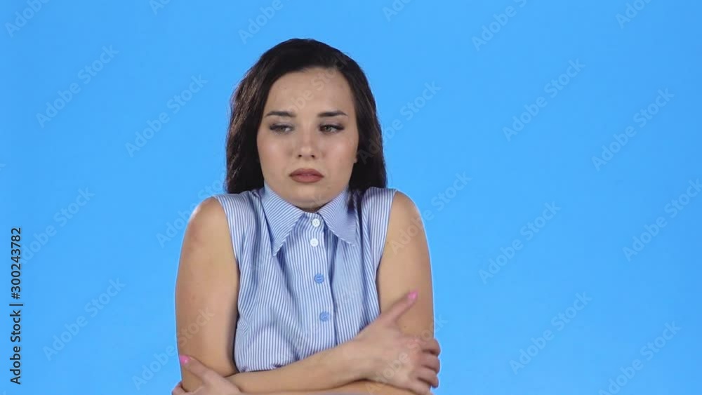 Young woman is shaking with cold and looking frozen. Slow motion Young woman is shaking with cold and looking frozen. Slow motion