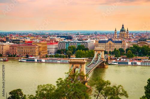 Famous Chain bridge and Saint Stephen Basilica in Budapest, Hungary photo