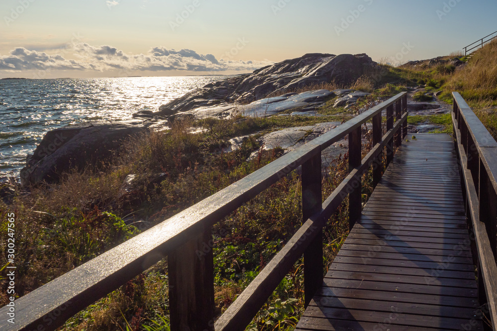 Northern landscapes. Lakes of Finland. View from the Sveaborg fortress. A wooden bridge near the shore. Northern landscapes of Finland. Traveling in Finland. Landscape of the surroundings of Helsinki