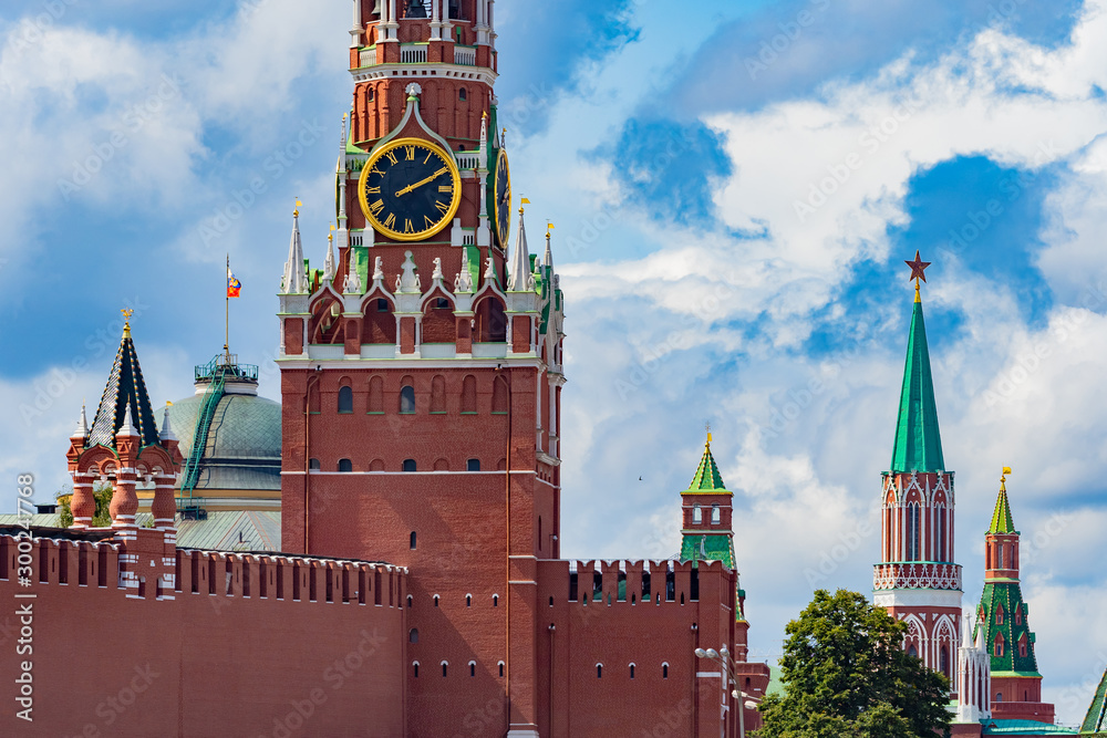 Fototapeta premium Moscow. Russia. Kremlin. Spasskaya Tower. Kremlin towers. Chimes of the Spassky tower. Time in Moscow. Excursions on the Red Square. Sights of Moscow. Cities of Russia. Skyline of the capital.
