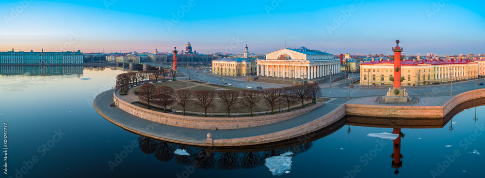 Naklejka premium Russia. Saint Petersburg. Vasilievsky island. Rostral columns. Arrow of Vasilyevsky Island. St. Isaac's Cathedral. St. Petersburg aerial view. Traveling in Russia. Winter in Petersburg. Excursions