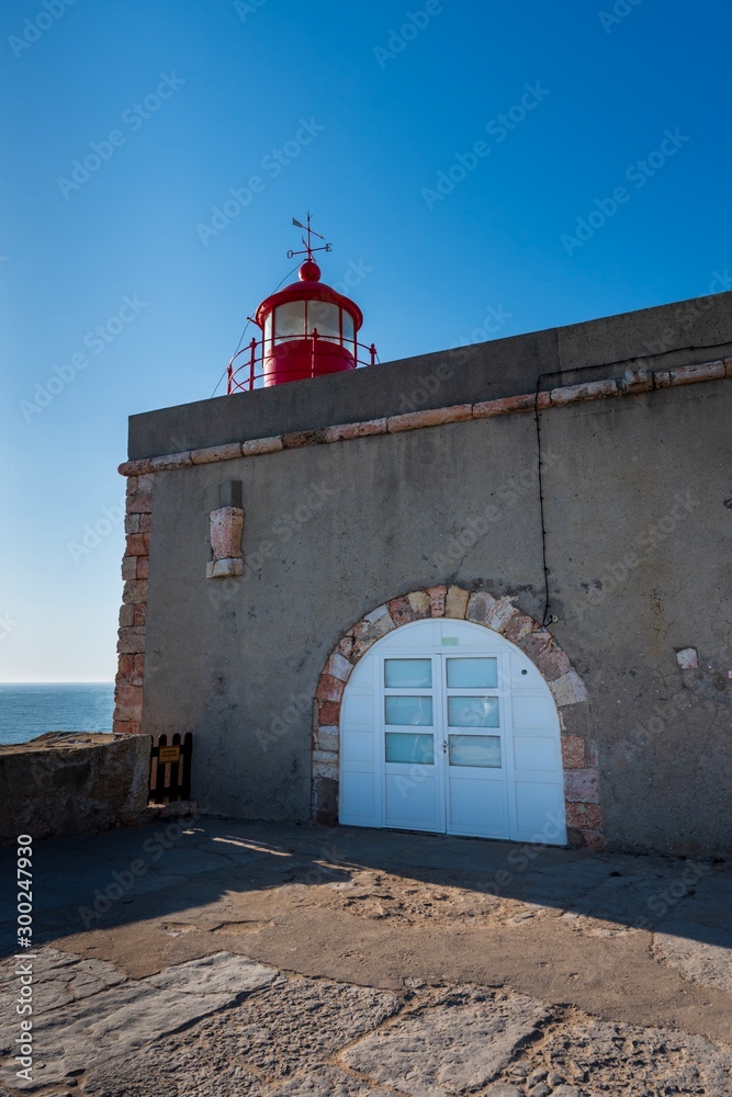 Lighthouse at Praia do Norte in Nazare, Portugal.
