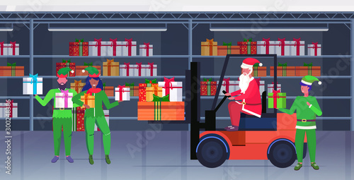 santa claus driving forklift truck elves holding colorful gift present boxes merry christmas happy new year celebration concept modern warehouse interior horizontal full length vector illustration