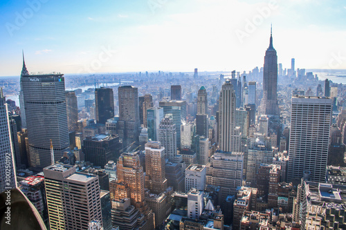 A skyline overlook viewpoint of Manhattan Including Empire State Building  Chrysler Building  Metlife Building and the One World Trade Center Tower in New York City 