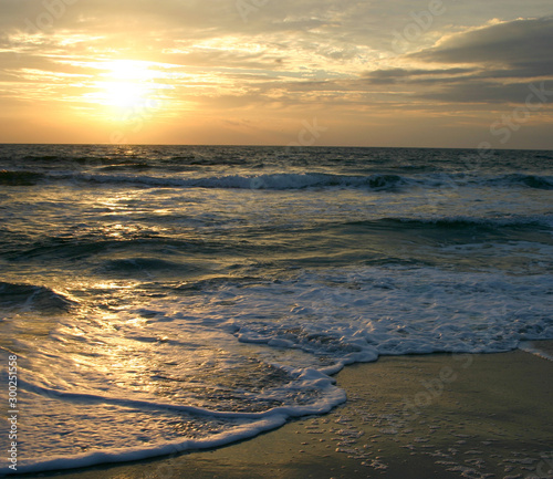 Fényképezés Dark, Restless Tide at Sunset