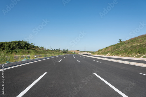 Brand new asphalt road horizon cloudless perspective landscape