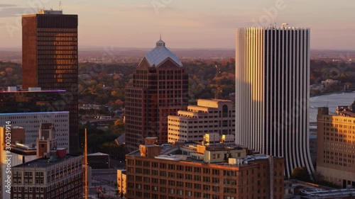 Rochester New York Aerial v31 Slow panning view of close up downtown skyline with river in backdrop at sunrise - October 2017 photo