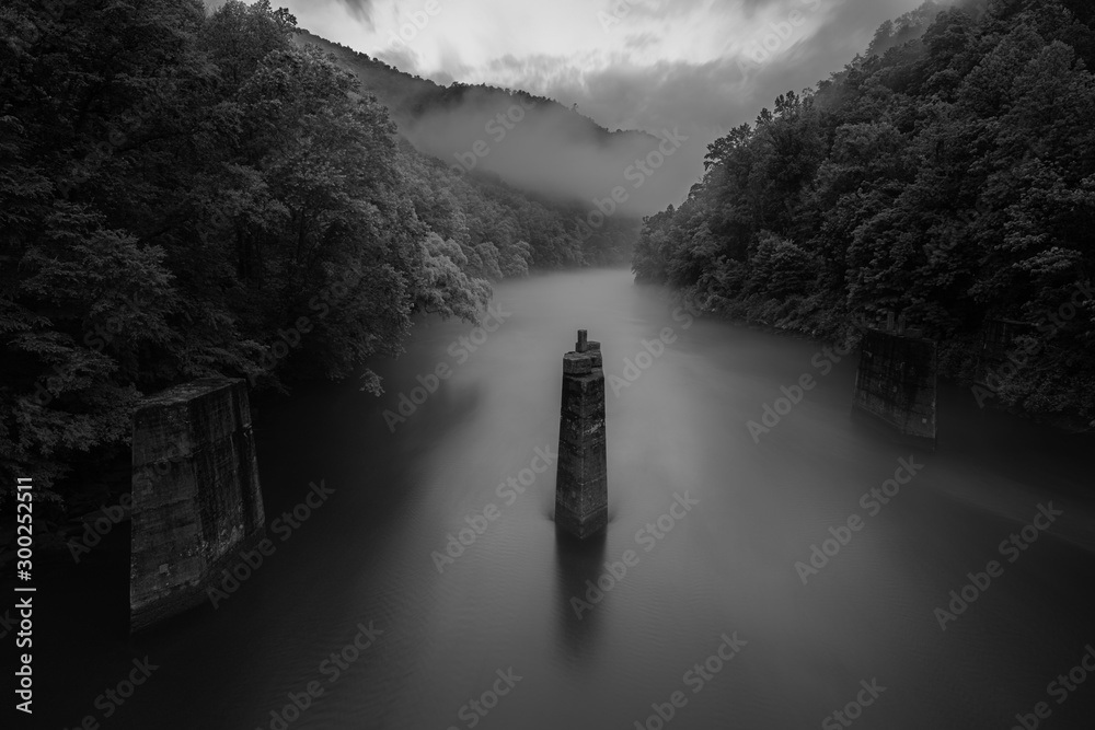 Εκτύπωση καμβά Fog Hanging Over Old Bridge Pylons