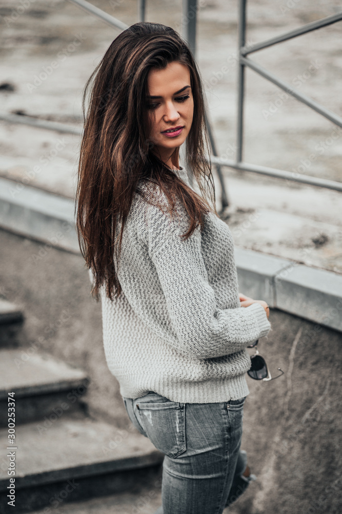 Beautiful girl posing in the street. Urban style. Street fashion.