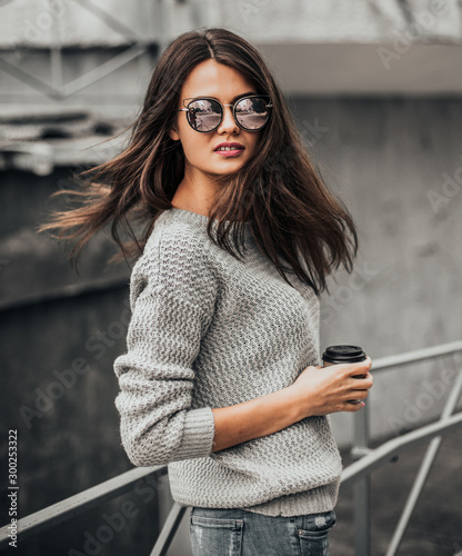 Beautiful girl posing in the street. Urban style. Street fashion.