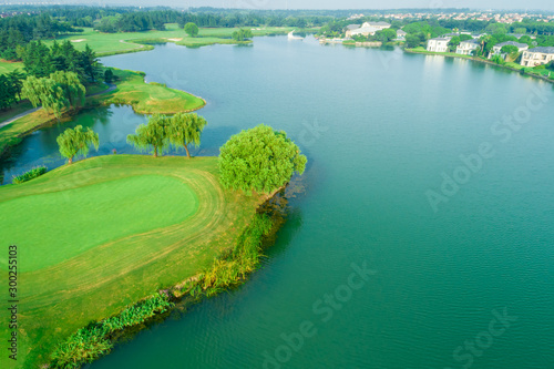 Aerial view of golf course and water