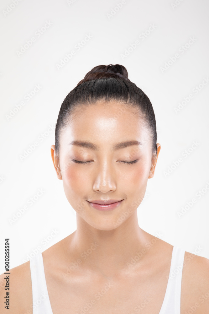 Beautiful Young Asian Woman Close her eyes smile feeling so happy and cheerful with healthy Clean and Fresh skin,isolated on white background,Beauty Cosmetology Concept Beautiful Young Asian Woman Close her eyes smile feeling so happy and cheerful with healthy Clean and Fresh skin,isolated on white background,Beauty Cosmetology Concept