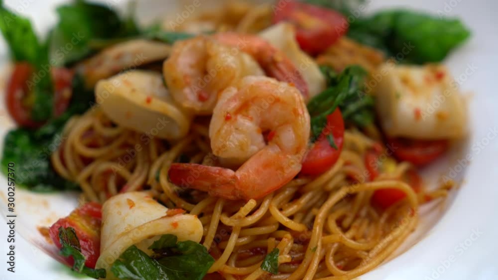 stir-fried spicy spaghetti seafood - fusion food style stir-fried spicy spaghetti seafood - fusion food style
