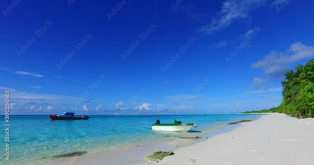 Beautiful sunshine morning on seashore of a tropical island where fishing boats anchored in Turks and Caicos islands Beautiful sunshine morning on seashore of a tropical island where fishing boats anchored in Turks and Caicos islands