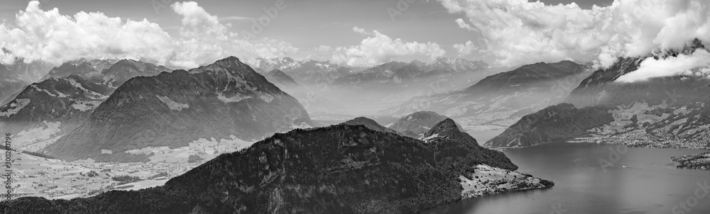 Switzerland, black and white panoramic view on green Alps and lake Lucerne Switzerland, black and white panoramic view on green Alps and lake Lucerne