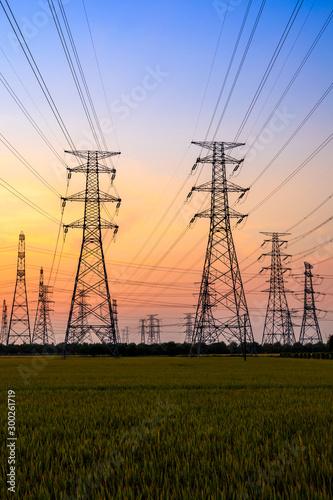 Electricity tower silhouette and sky landscape at dusk