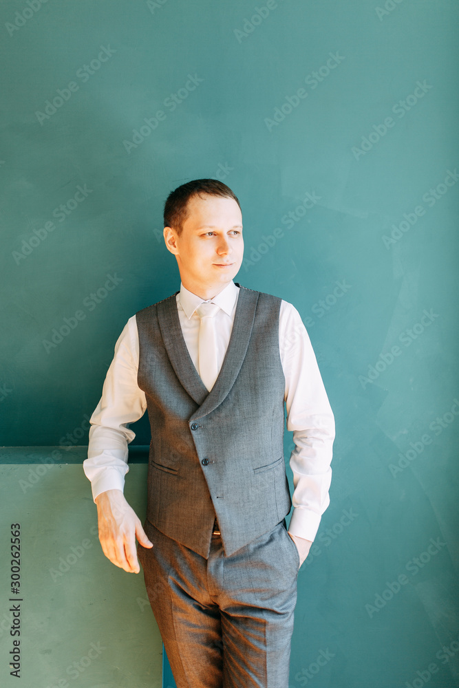 European wedding in the hotel. Gathering the groom in the interior Studio.