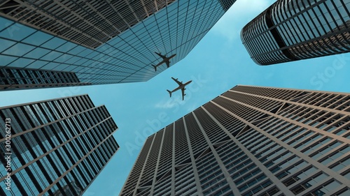 Airplane flies over skyscrapers in modern city