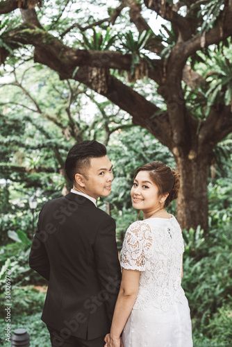 Asian loving couple pre-wedding outdoor photo shoot. Casual natural real people portraits. Loving romantic couple. © Jerome Quek