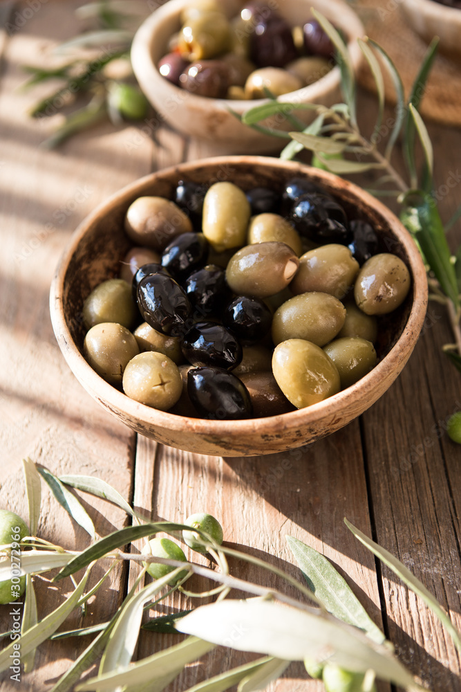 bowls with different kind of olives green , black, kalamata on table bowls with different kind of olives green , black, kalamata on table