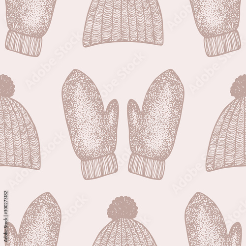 Hand drawn mittens and hat seamless pattern. Winter vintage vector background