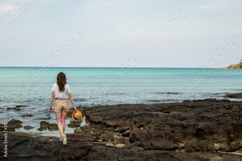Young woman on the shore of a beautiful bay in Thailand, Koh Kood island