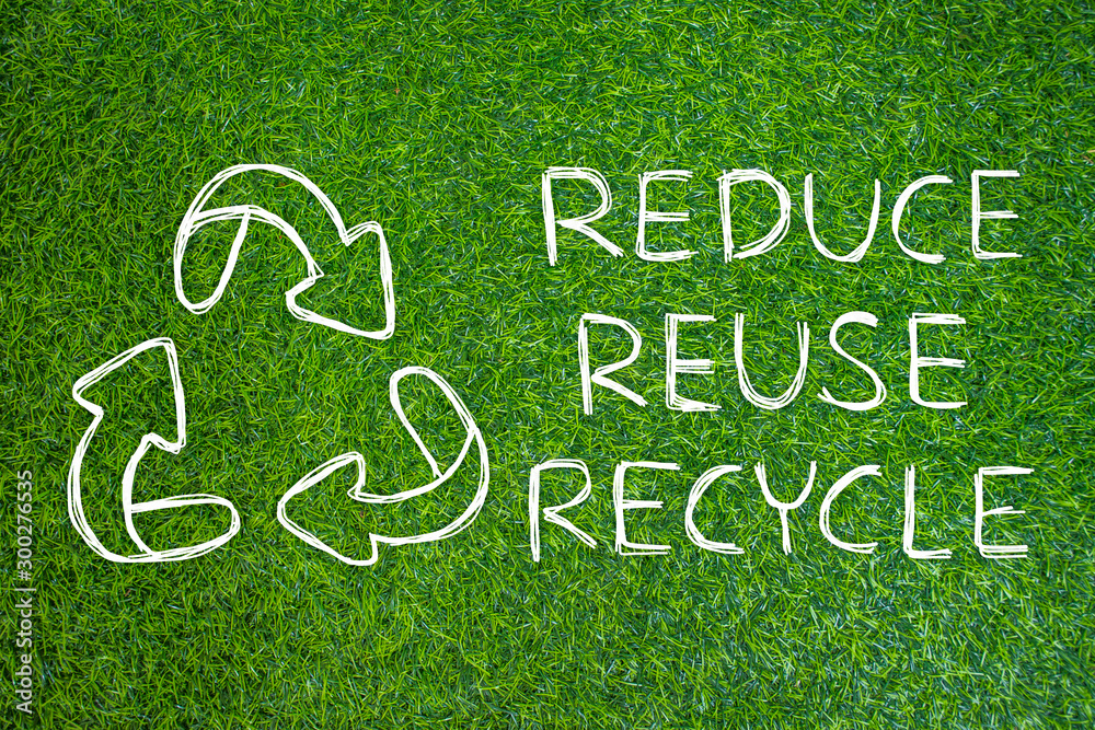 Reduce - Reuse - Recycle symbol hand drawing with green nature background. Reduce - Reuse - Recycle symbol hand drawing with green nature background.