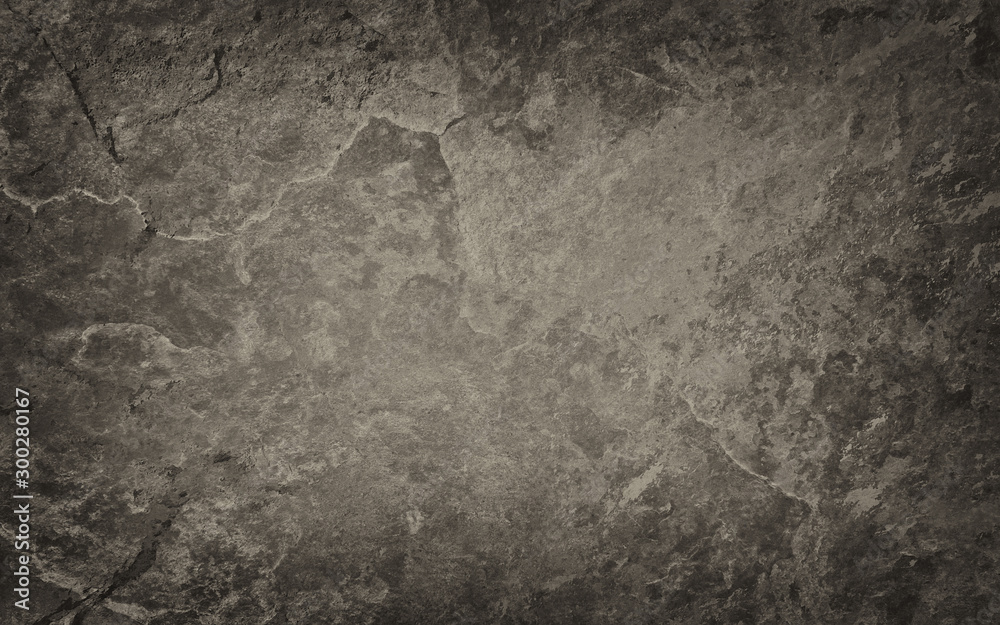 Brown and black background with vintage grunge texture, old textured stone or rock wall 