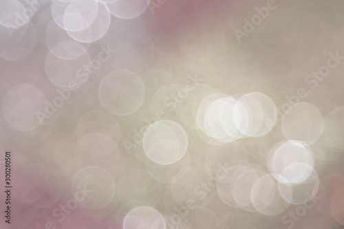 Beautiful colorful festive blurred background for christmas design, copy space. Unique powder pink and emerald green and light gold color backdrop. 