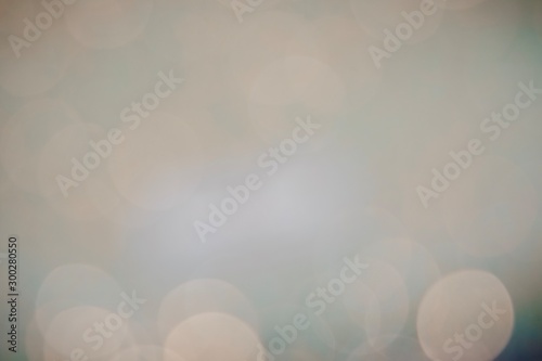 Beautiful colorful festive blurred background for christmas design, copy space. Unique powder pink and emerald green and light gold color backdrop. 