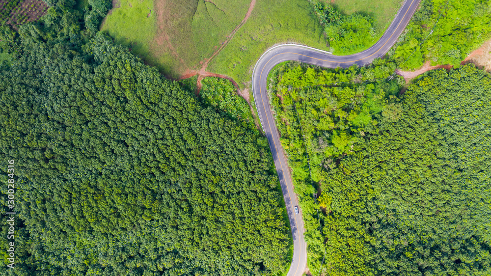 Aerial view of Rural road in countryside area, view from drone - obrazy, fototapety, plakaty 