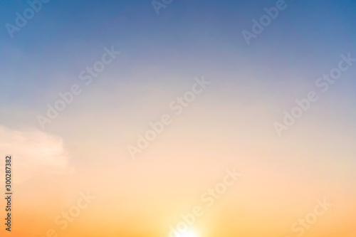 Colorful sky in twilight time with sun background. © Chanintorn.v