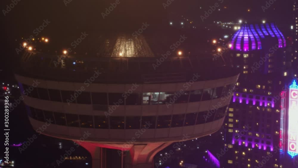 Niagara Falls Ontario Aerial v18 Panning Skylon Tower detail to reverse cityscape view at night - October 2017