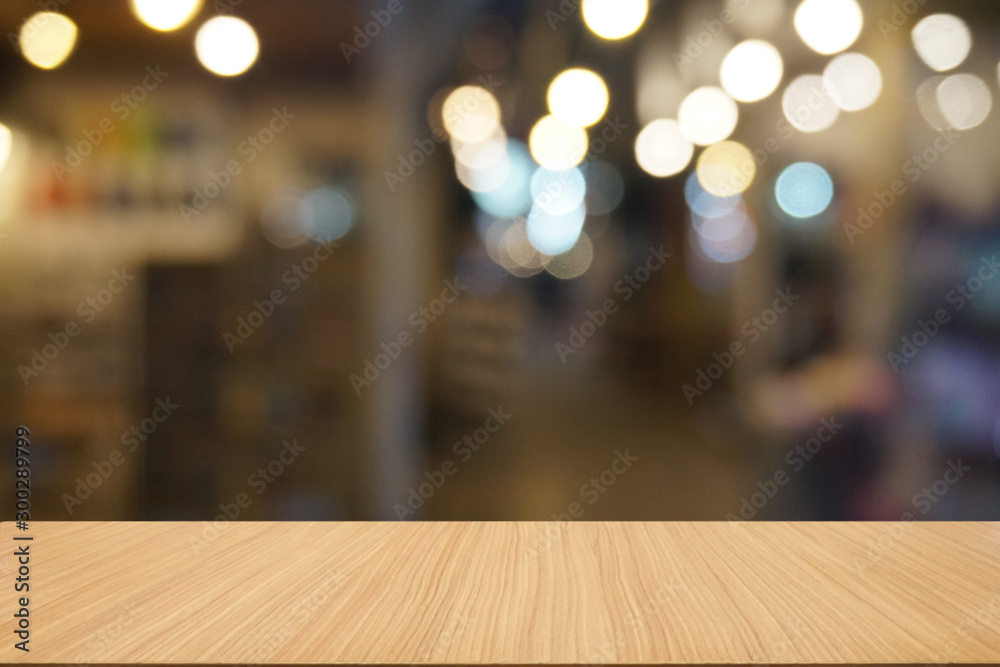 Empty dark wooden table in front of abstract blurred bokeh background of restaurant . can be used for display or montage your products.Mock up for space. Empty dark wooden table in front of abstract blurred bokeh background of restaurant . can be used for display or montage your products.Mock up for space.