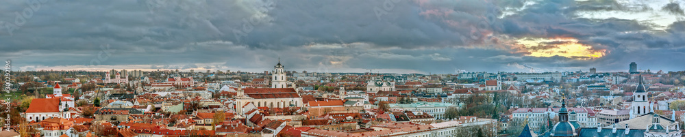 Panoramic cityscape of Vilnius city old town with red roofs and churches