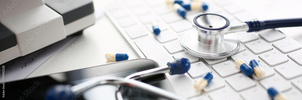 Stethoscope and Pharmaceutical Pill Lying Keyboard Stethoscope and Pharmaceutical Pill Lying Keyboard