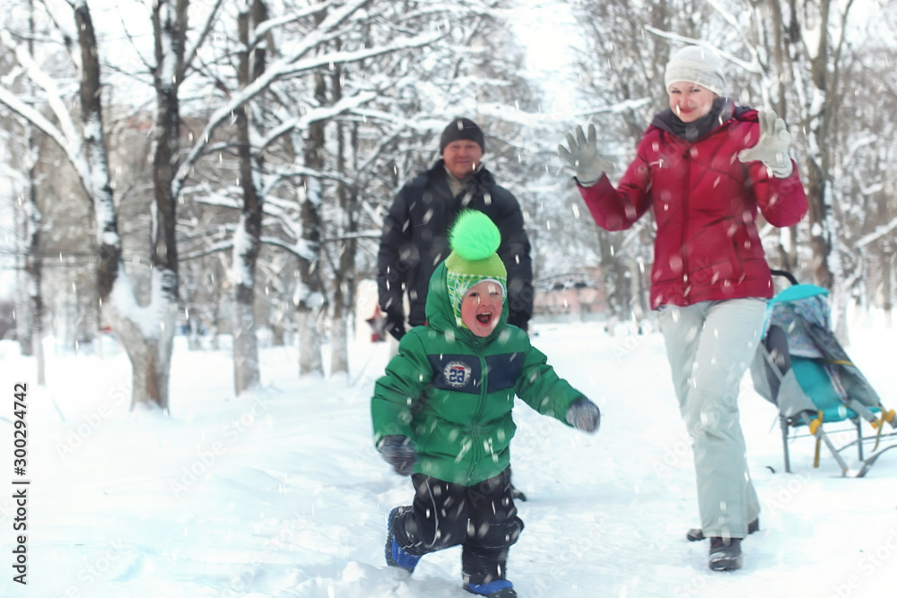 Young family in winter park Young family in winter park