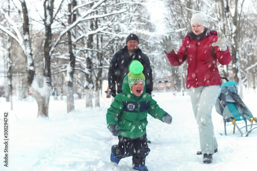 Young family in winter park