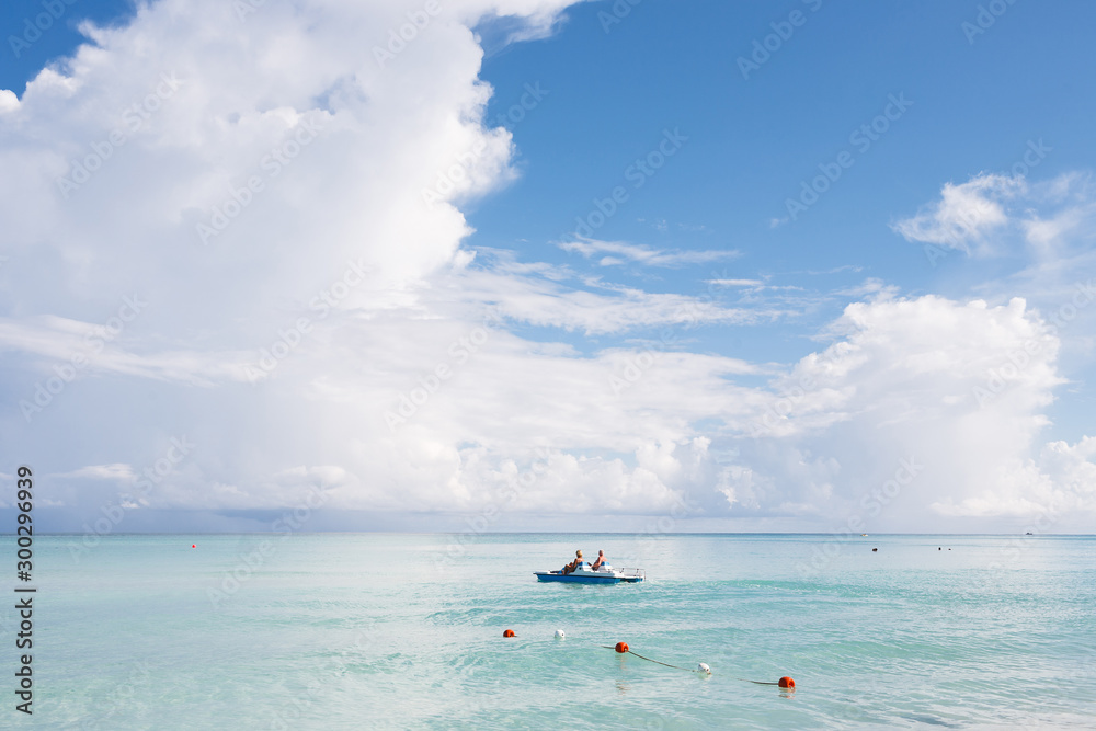 Happy tourists kayaking in the transparent water of Caribbean, Varadero, Cuba