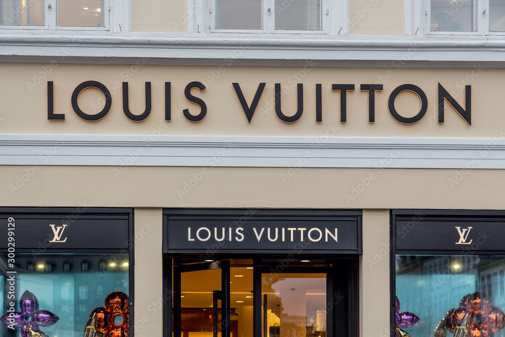Louis Vuitton store entrance. Louis Vuitton brand logo logotype