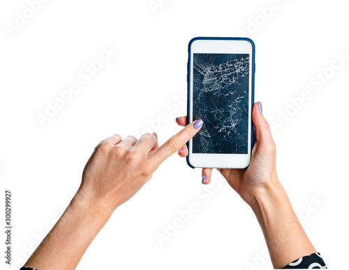 Woman hands holding smartphone with cracked screen isolated on white